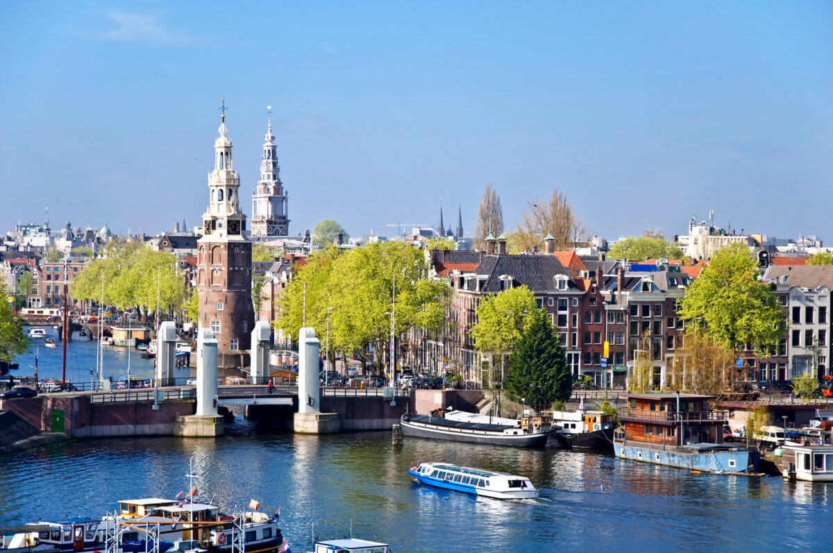 20 Insider Secrets for Exploring Amsterdam on a Shoestring: Your Ultimate Budget-Friendly Guide 1 Aerial view of Amsterdam showcasing its iconic canals, unique architecture, and vibrant cityscape