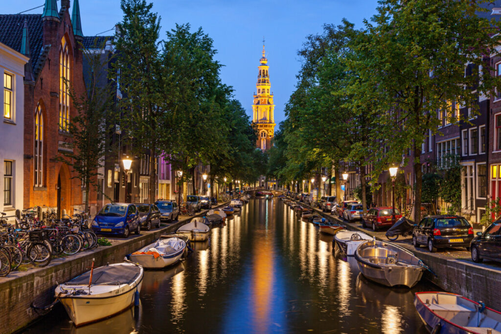 Solo Travel in Amsterdam: A Guide to Exploring the City Alone 12 Night lights and night view of the canals and houses in Amsterdam, Netherlands