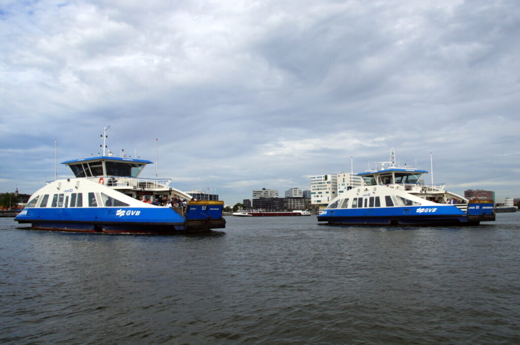 How to Get Around Amsterdam: 10 Insider Secrets for Easy City Navigation 6 Panoramic view of two ferries at IJ river in Amsterdam, Netherlands