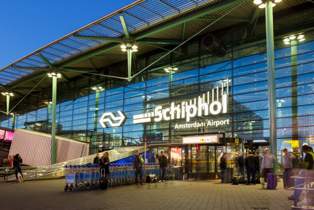 Amsterdam Airport Train vs Taxi: Which Is Better in 2026? 23 Main terminal entrance at Amsterdam Airport Schiphol