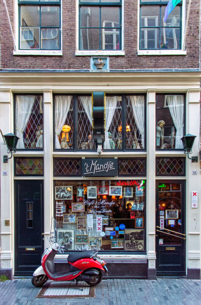 Exploring Amsterdam’s Red Light District: History, Etiquette, and Culture 8 Front and entrance of the Cafe 't Mandje in Amsterdam, Netherlands