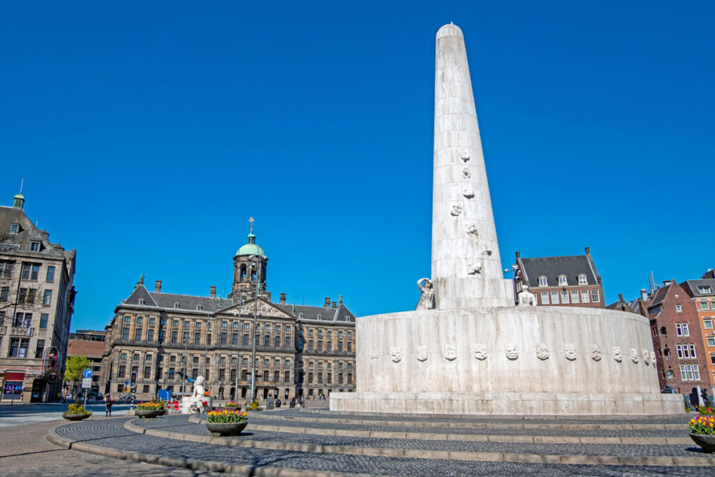 Solo Travel in Amsterdam: A Guide to Exploring the City Alone 7 The National Monument and the Royal Palace at the Dam Square in Amsterdam, Netherlands