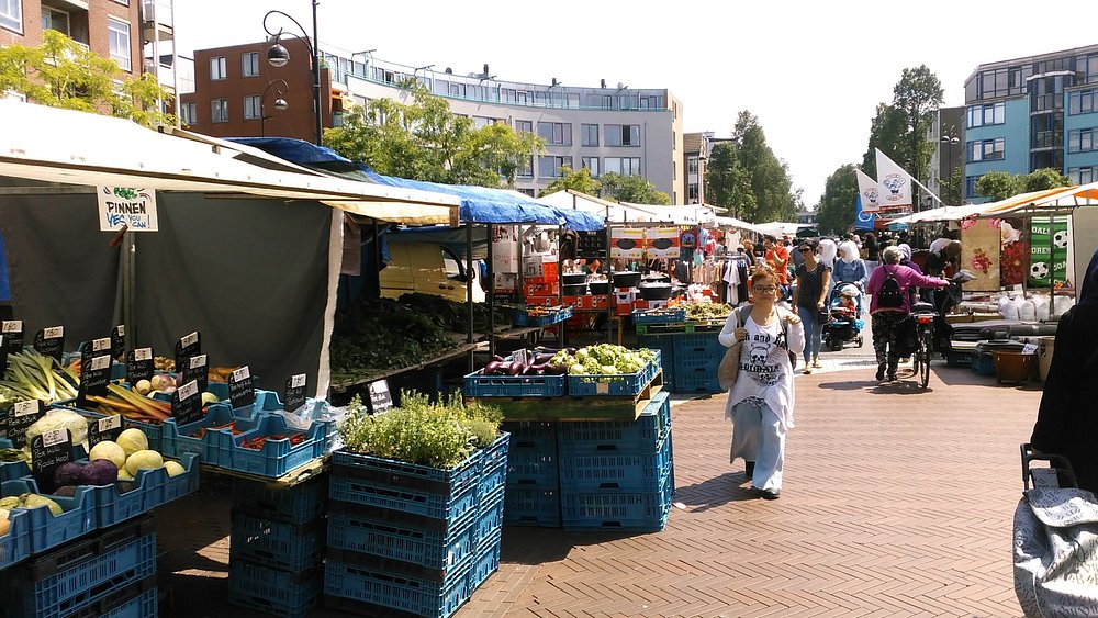 Amsterdam Picnic Locations and Tips: Discover the Best Spots and Expert Advice 14 Fresh produce and food stalls at Dappermarkt street market in East Amsterdam