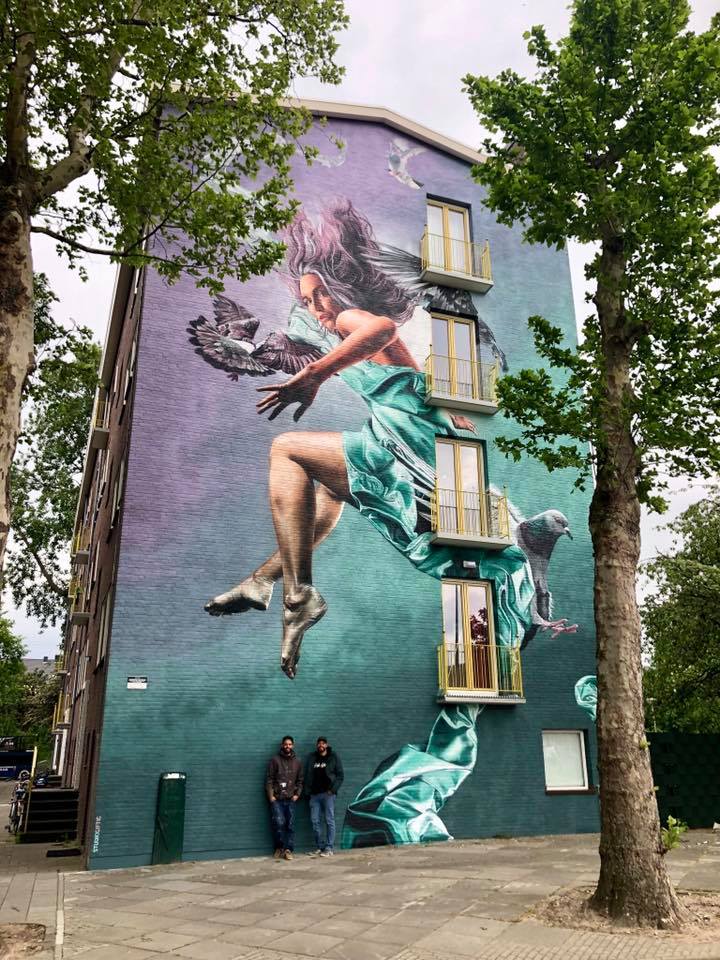 Large mural of a woman on an Amsterdam wall