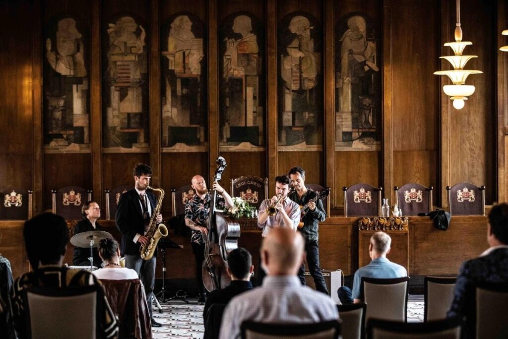 Musicians performing beneath a grand painting at a Grachtenfestival concert in Amsterdam