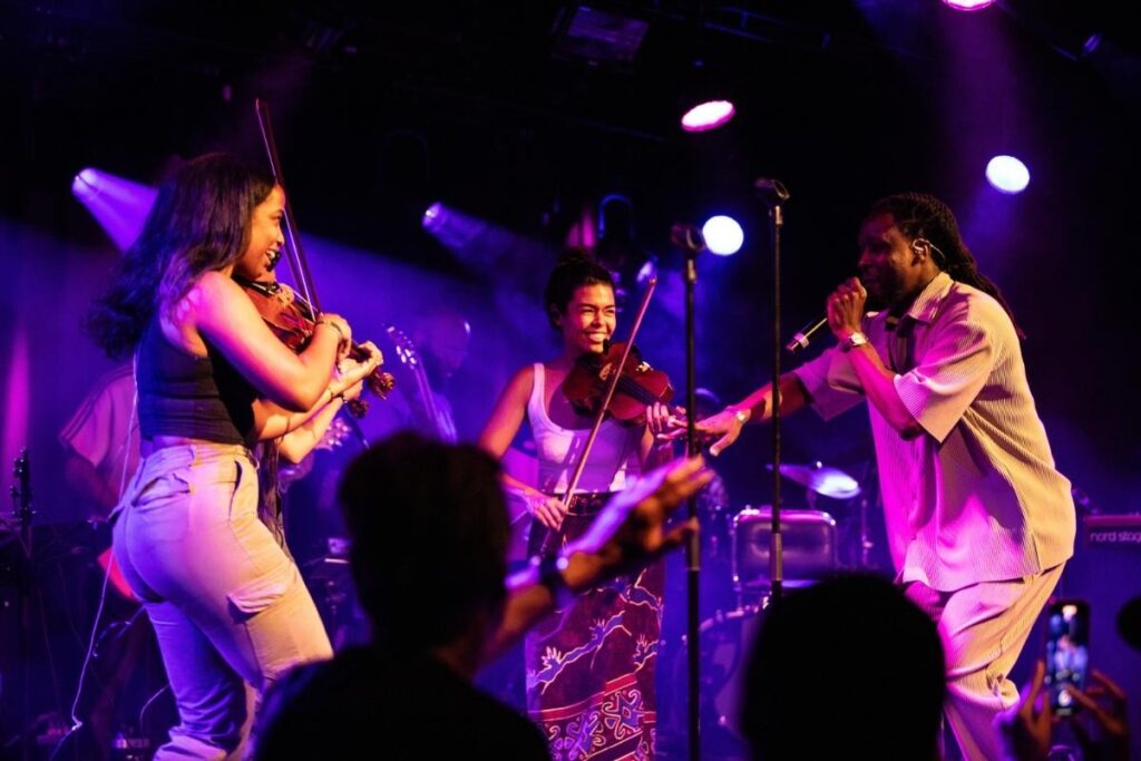 Ensemble of musicians performing on a floating Prinsengrachtconcert stage in Amsterdam