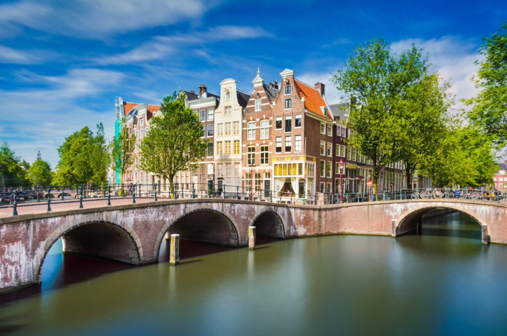 15 Iconic Amsterdam Canals: Explore the UNESCO World Heritage Waterways 2 Bridge at the intersection of Brouwersgracht and Herengracht canals in Amsterdam, surrounded by historic buildings