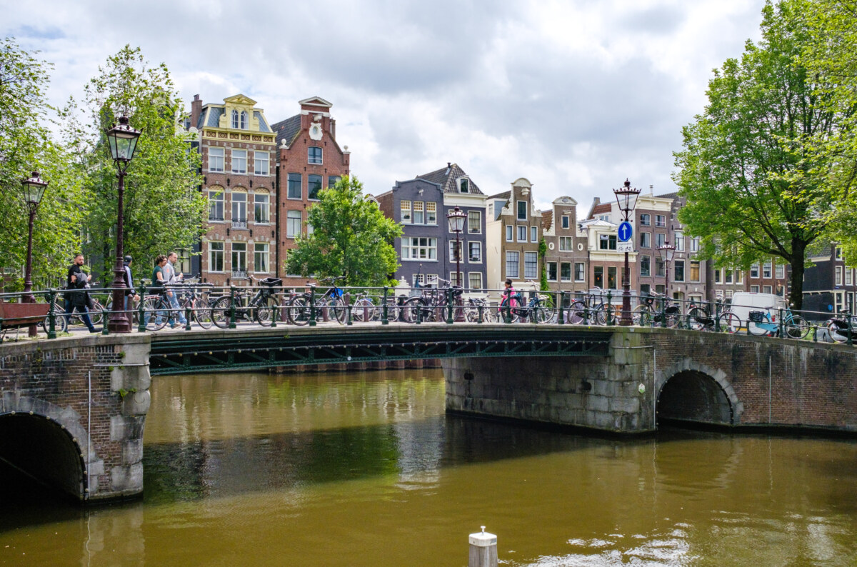 15 Iconic Amsterdam Canals: Explore the UNESCO World Heritage Waterways 1 Scenic bridge located at the corner of Brouwersgracht and Herengracht canals in Amsterdam, with charming architecture nearby
