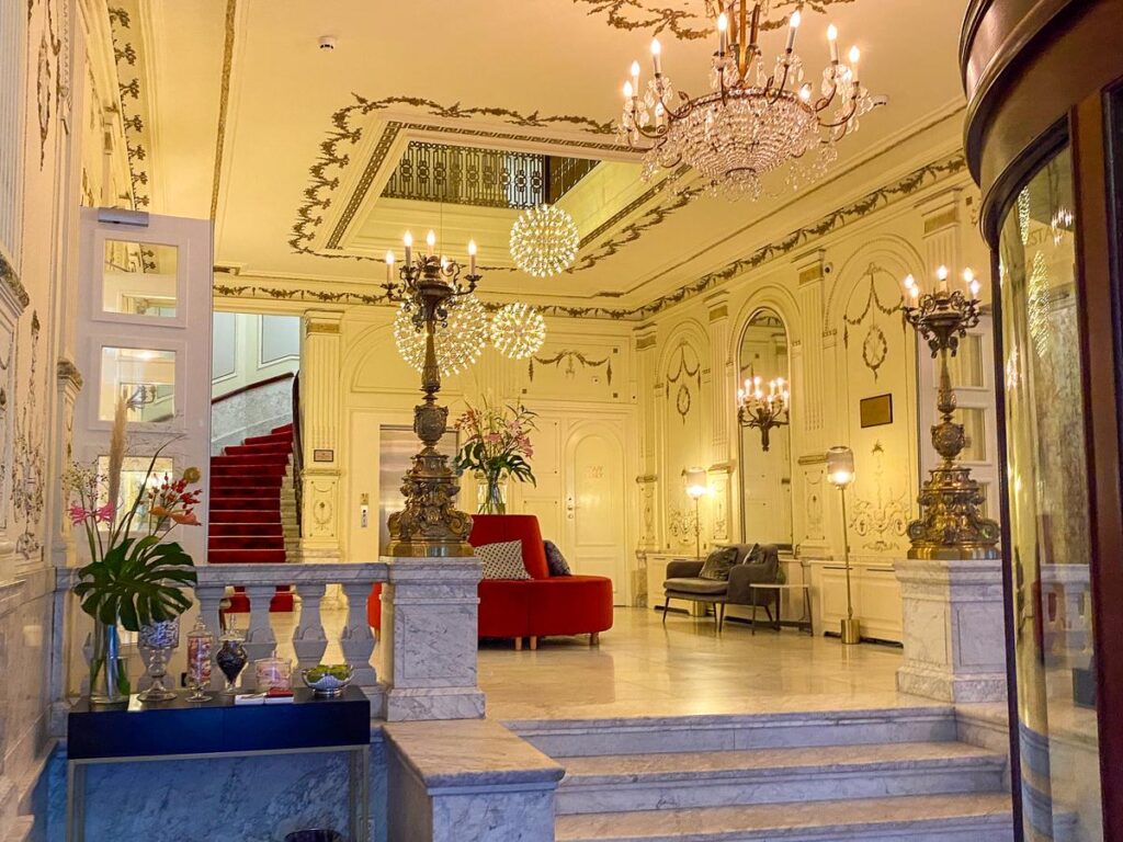 Tivoli Doelen Amsterdam Hotel 4 Luxurious Tivoli Doelen Amsterdam Hotel lobby with grand staircase and chandeliers