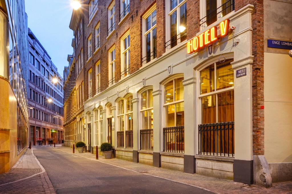 Where to Stay for Amsterdam Dance Event: 2026’s Top Areas & Insider Tips 10 Exterior of Hotel V Nesplein in Amsterdam, showcasing a street scene with a sign that reads "Hotel V"