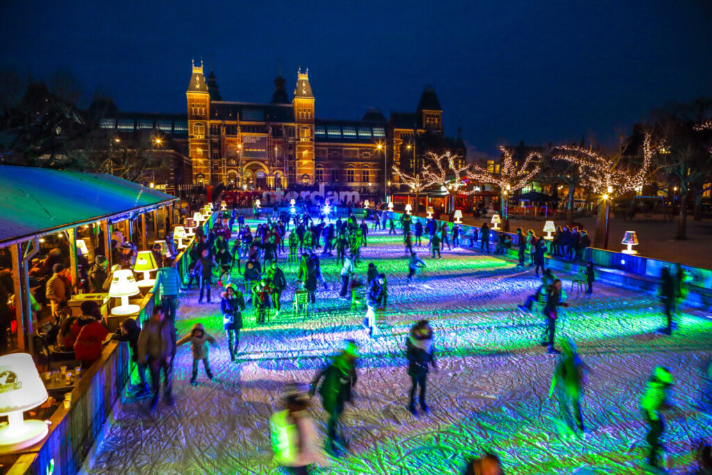 People Ice Skatingat the Ice Village winter ice skating rink on Museumplein in front of Rijksmuseum