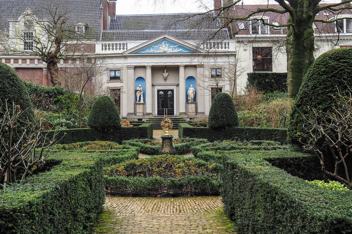 17 Unusual Ways to Explore Amsterdam 1 Exterior and Museum van Loon garden in Amsterdam, Netherlands