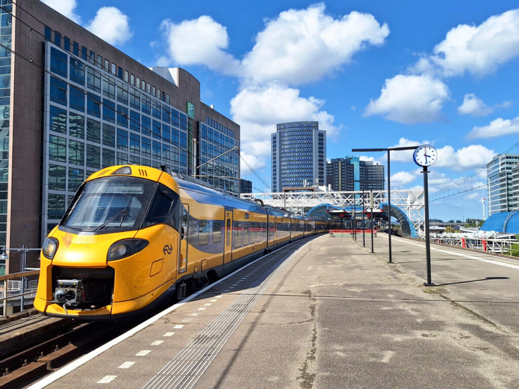 NS ICNG intercity train positioned on the tracks at Amsterdam Sloterdijk, awaiting passengers.
