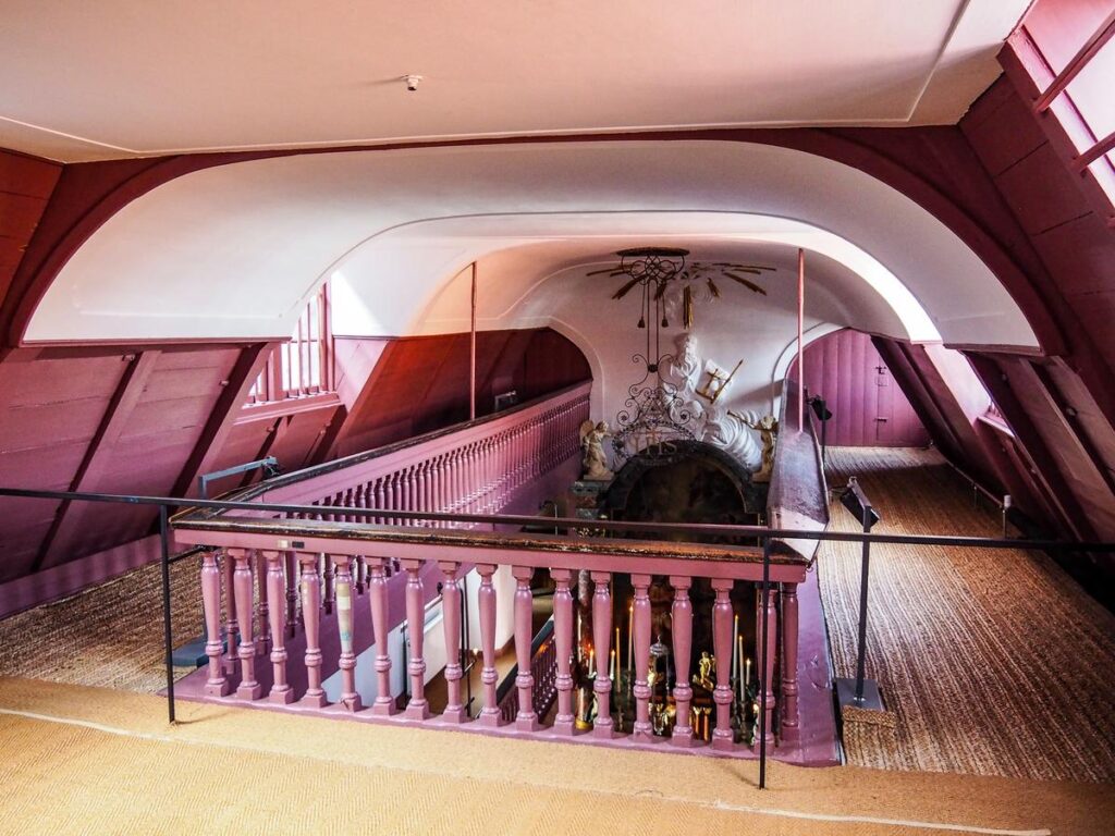 Amsterdam's Hidden Gems: 12 Off-the-Beaten-Path Attractions 21 Clandestine church altar and pews at the Ons' Lieve Heer op Solder Museum in Amsterdam, Netherlands