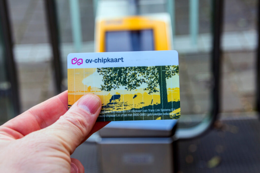 Hand holding a OV-chipkaart Card for travel