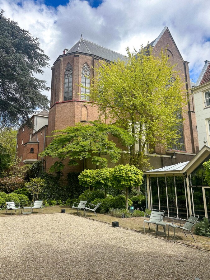 Pulitzer Amsterdam 6 Tranquil Oasis at Pulitzer Hotel Amsterdam - Historic charm and modern elegance in serene interior courtyard.