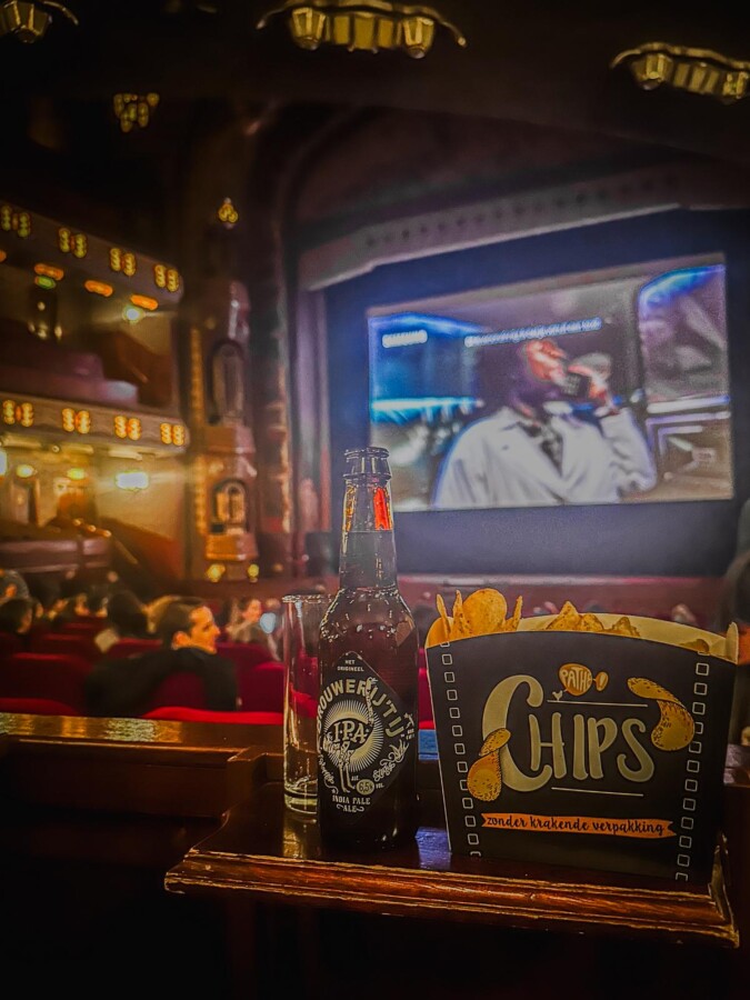 17 Unusual Ways to Explore Amsterdam 9 WAtchinga movie at Pathé Tuschinski Theater with a snack on the side
