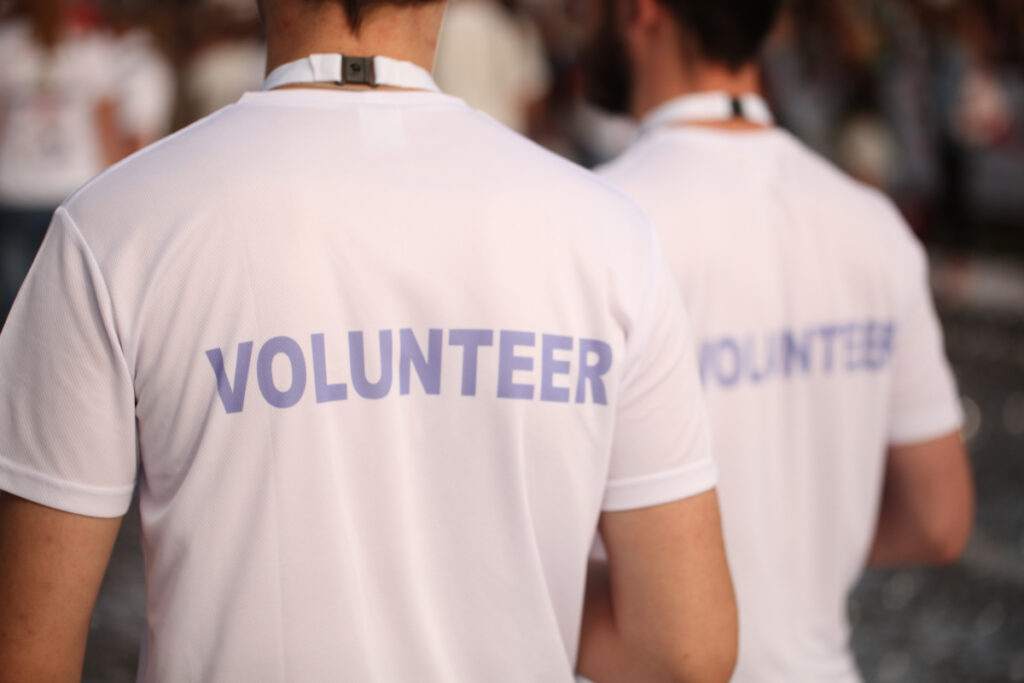 Volunteering in Amsterdam: Where to Lend a Hand 2 Men in volunteer white T-shirts