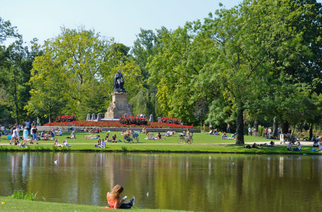Panoramic view of the Vondelpark locals and tourists relaxing on the park