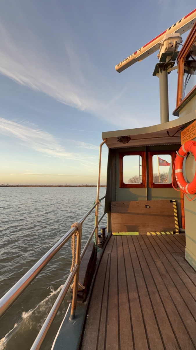Vuurtoreneiland 6 Wooden deck and pilot house of the historic IJveer XIII ferry boat sailing across the IJmeer