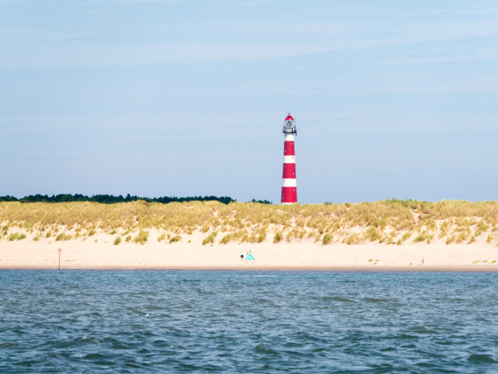 Walking the Netherlands' New Long-Distance Salt Path: A Journey Through Nature and Culture 16 The beach and lighthouse of Ameland Island, located in the Wadden Sea in Friesland, Netherlands