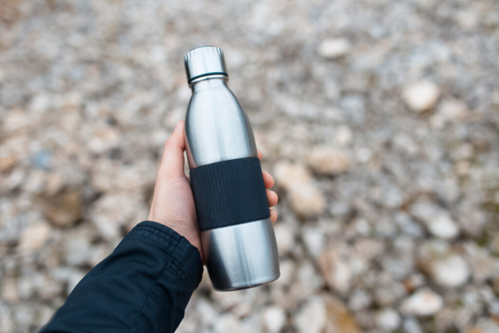 Close-up of male hand holding a water bottle