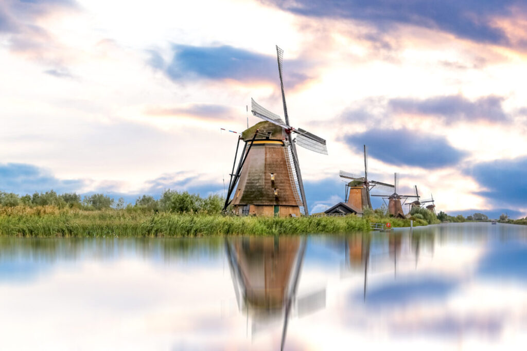 Kinderdijk vs Zaanse Schans Windmills: Which Dutch Icon Wins? 22 Charming Zaanse Schans Village in The Netherlands, showcasing traditional windmills against a picturesque backdrop.